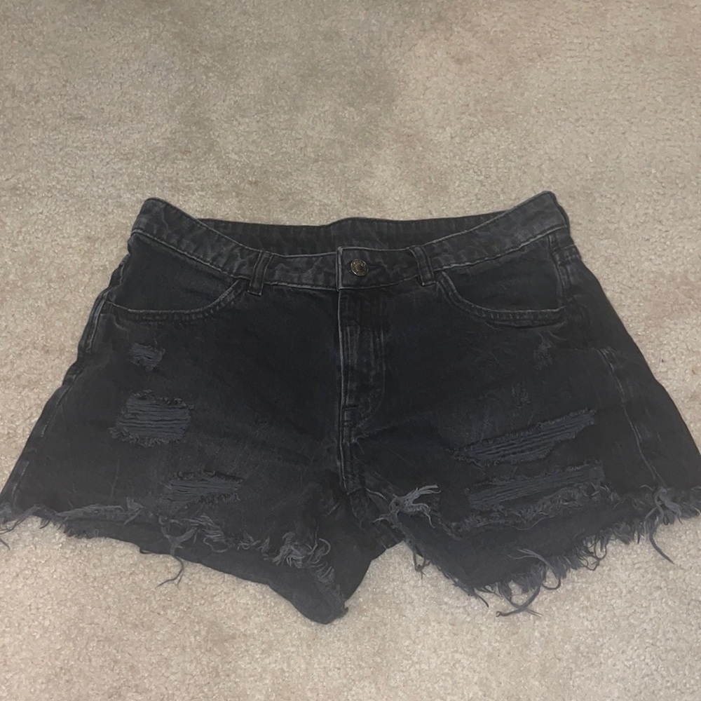 Distressed black jean shorts